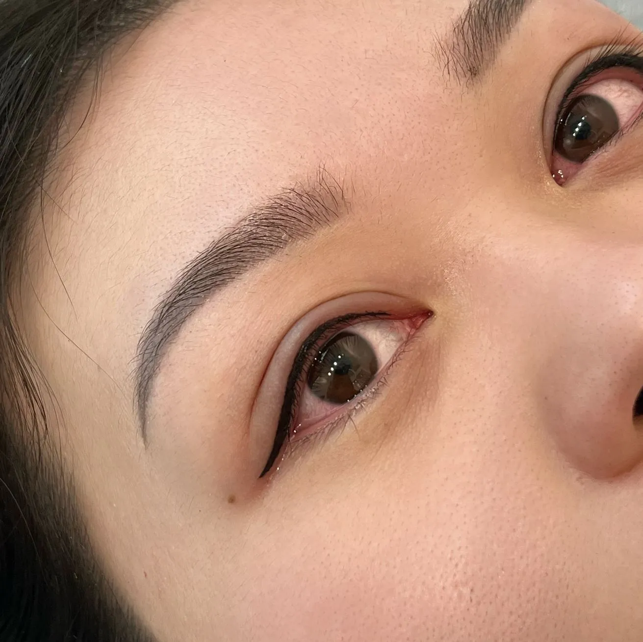 Who is not a candidate for an eyeliner tattoo?